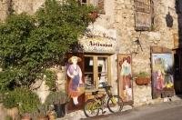 An art store lines a narrow road in the village of Aiguines in the Alpes de Haute region of the Provence, France.