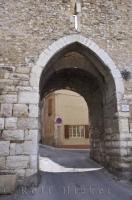 One of the two ancient entrances, the Porte Saint Sols, in the 16th century wall, welcomes visitors to the village of Riez in the Alpes de Haute region of Provence, France.