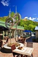 A metal sculpture set in the paved, private square of an art gallery and cafe in Arrowtown, Central Otago, New Zealand.