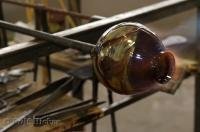 The interesting art of glass blowing which produces blown glass objects such as this vase.