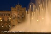 By day tourists flock to see Plaza de Espana with its beautiful Moorish Revival architecture, a highlight during a tour of Sevilla in the southernmost region of Spain - Andalusia. It's a different scene by night, with only the sound of the large fountain.