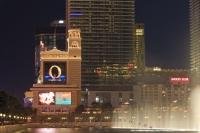 The distinctive Bellagio sign is lit up at night and features it's main attraction, Cirque du Soleil's O and cannot be mistaken as one drives or wanders along the famous Las Vegas Strip, beside the water show of the hotel and casino.