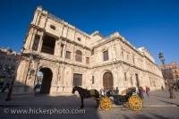 A buggy carriage sits outside City Hall in the Plaza de San Francisco in the Santa Cruz District in Sevilla City, Andalusia in Spain.