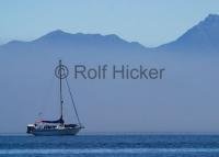 A sailboat on a coastal vacation trip in Johnstone Strait