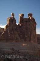 The Three Gossips are situated in the Courthouse Towers area of Arches National Park in Utah, USA.