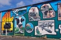 This full wall mural painting depicts the history of the town of Opunake in the Taranaki, North Island, New Zealand.