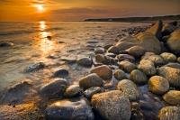 With a wide sweeping beach of large boulders, Green Point in Gros Morne National Park on the Northern Peninsula of Newfoundland is a perfect location to watch a sunset over the Gulf of St Lawrence.