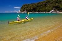 A popular vacation activities on the South Island of New Zealand is kayaking the pristine coastal waters of the Abel Tasman National Park.