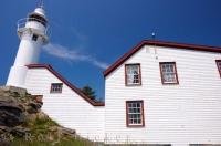 Built in 1892, the Lobster Cove Lighthouse and the building has stood on the cliff overlooking the waters off Newfoundland, Canada.
