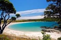 The white sandy beach of Maitai Bay on the Karikari Peninsula beckons visitors to its shores. The Karikari Peninsula is situated in Northland, New Zealand.