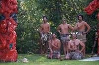Maori warriors dressed in traditional costumes at the Wairakei Terraces near Taupo on the North Island of New Zealand.