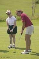 Stock photo of women receiving some Golf Putting Ttips on the 9 hole golf course at Dhoon Lodge.