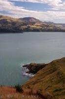 A scenic view towards Banks Peninsula and over Lyttelton Harbour on a beautiful sunny day in Canterbury. The steep sides of Lyttelton Harbour can be attributed to an extinct volcanic crater.