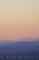 A soft and hazy sunset over the Serre de Montdenier in the Alpes de Haute region of the Provence, France highlights layers in the landscape.