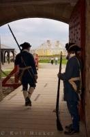 The soldiers dressed in their traditional uniform from the eighteenth century, guard the entrance to the King's Bastion at the Fortress of Louisbourg in Nova Scotia, Canada.