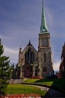 Beautiful manicured grounds and flower beds surround the Trinity Church in the downtown area of Saint John in New Brunswick, Canada.
