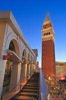 Twilight is a magical time of day anywhere, but in particular at The Venetian Hotel and Casino where replicas of famous landmarks of Venice are lit up in the bustling city of Las Vegas, Nevada, USA.