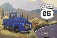 A drawing of a roadrunner and old truck in a wall mural on the Mohave Museum building in Kingman, Arizona.