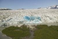 Aerial view of blue ice at the glacier tongue of the Juneau Icefield in Tongass National Forest in Southeast Alaska