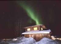Stock photo of a cabin in the Brooks Range in Alaska with Northern Lights