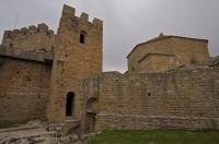 The castle of Loarre (aka Castillo de Loarre) towers over the village of Loarre in Aragon, Spain in Europe.