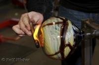 The finishing touches are added to an art piece at the Lincoln City Glass Center in Oregon.
