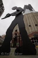 A sculpture, the Hammering Man by Artist Jonathan Borofsky, with moving parts situated outside the Art Museum in downtown Seattle, Washington, USA.