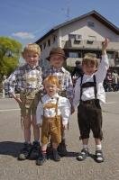 Children wore costumes of Lederhosen and suspenders during the Bavarian Maibaumfest in Putzbrunn, Germany.