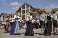 The Bavarian dance pairs practice their routine prior to the Maibaumfest in Putzbrunn, Germany.