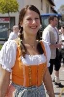 A traditional Bavarian dirndl worn by a woman at the Maibaumfest in Putzbrunn, Germany.