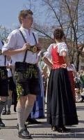 A man at a Bavarian festival is having a great time dancing around the Maibaum in Putzbrunn, Germany.