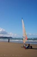 A newly founded sport and an easy way to travel Orewa Beach on the North Island of New Zealand is by land sailing.