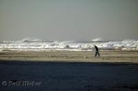 A couple enjoy a walk along Long Beach in Washington, USA.