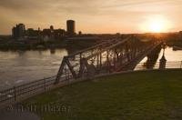 This bridge is the Pont Alexandra which crosses the Ottawa River at Nepean Point in Ottawa, Canada.