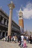 The Campanile towers over the busy Piazza San Marco in Venice, Italy.