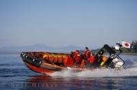 The Canadian Coast Guard fly the flag from the stern of the Zodiac.