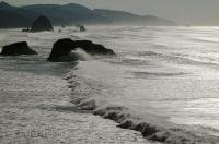 One of the most spectacular scenes of the mighty Pacific Ocean of large waves rolling in to Cannon Beach in Oregon, USA.