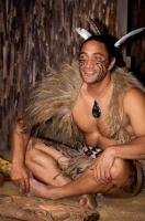 A Maori warrior shows visitors to the village at the Wairakei Terraces near Taupo, New Zealand, a carving demonstration.