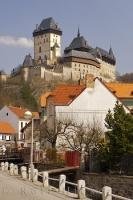 The medieval Karlstejn Castle stands guard above the village of Karlstejn in the Czech Republic, Europe.