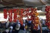 Chili peppers hang from a line in Chinatown in Toronto, Ontario in Canada.