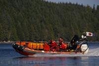 A crew of three from the Canadian Coast Guard check the shoreline of Malcolm Island, British Columbia.
