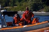 The Canadian Coast Guard in a zodiac off Malcolm Island in British Columbia, Canada.