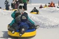 A family at play on a cold winters day at the Quebec Winter Carnival in the city of Quebec, Canada.