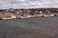 Tied up to the wharf at Covehead Bay in Queens, Prince Edward Island are fishing boats used by the local residents.