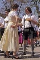 A couple participate in dancing during the Maibaumfest in Putzbrunn, Germany.