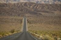 The good conditions of the main desert road which runs through Death Valley, California help with the long hot drive.