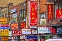 Hundreds of decorative signs displayed on the buildings in Chinatown in the City of Toronto, Ontario in Canada.
