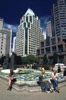 Georgia Street in downtown Vancouver, British Columbia has beautifully designed skyscrapers towering above you.