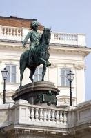 Standing guard outside the Albertina Museum along a busy road in downtown Vienna, Austria is an equestrian statue of Franz Josef I.