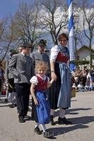 A European child looking pretty in her traditional dirndl at the Maibaumfest in Putzbrunn, Germany.